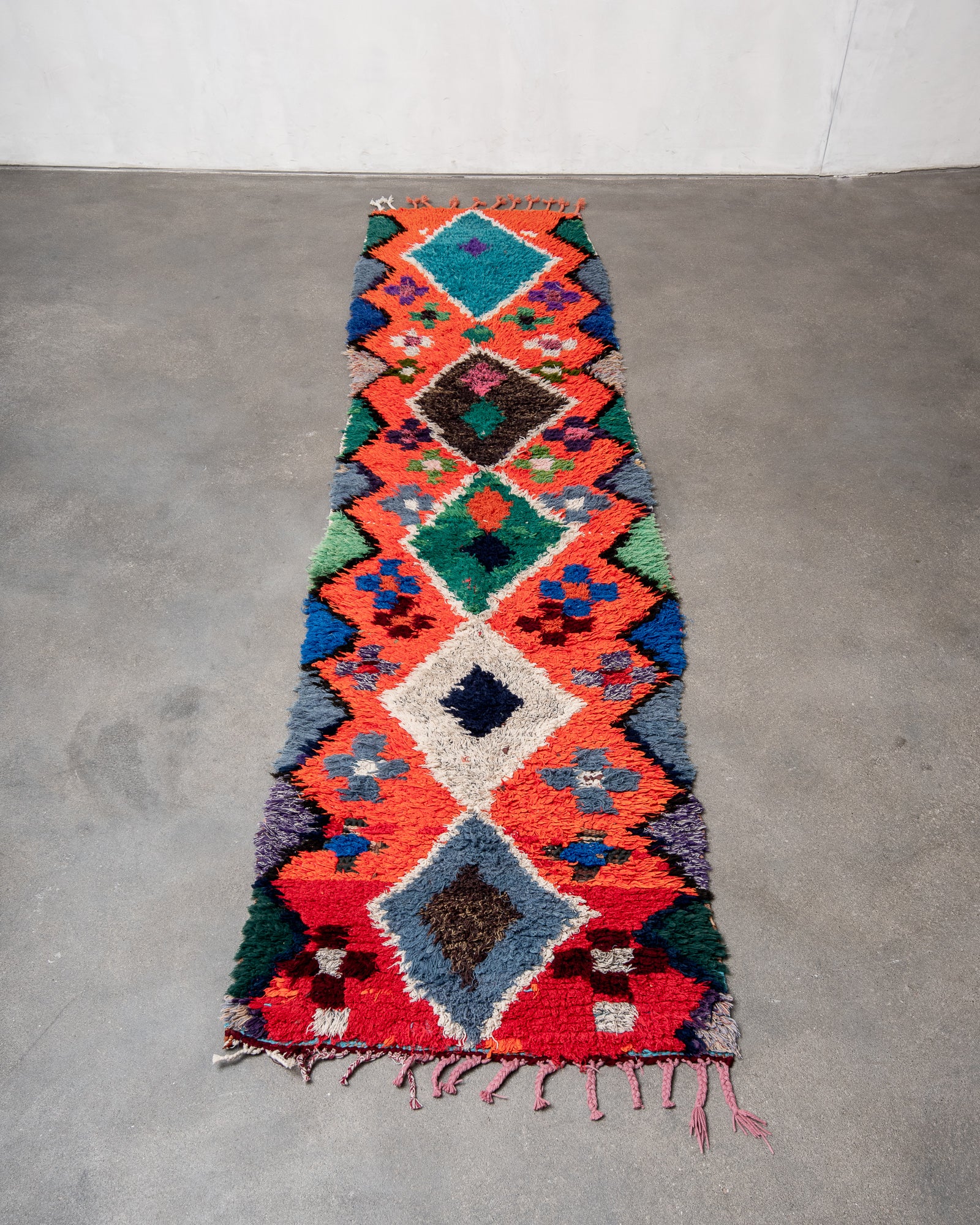 Modern, designer, handcrafted Berber rug from Morocco. Boucherouite carpet with beautiful colours and patterns and fluffy wool texture.